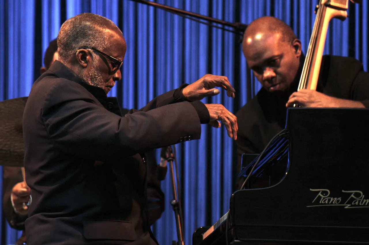 Photograph of Ahmad Jamal at the piano.