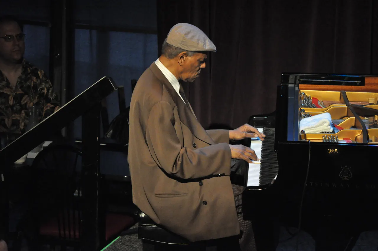 Photograph of McCoy Tyner at the piano.