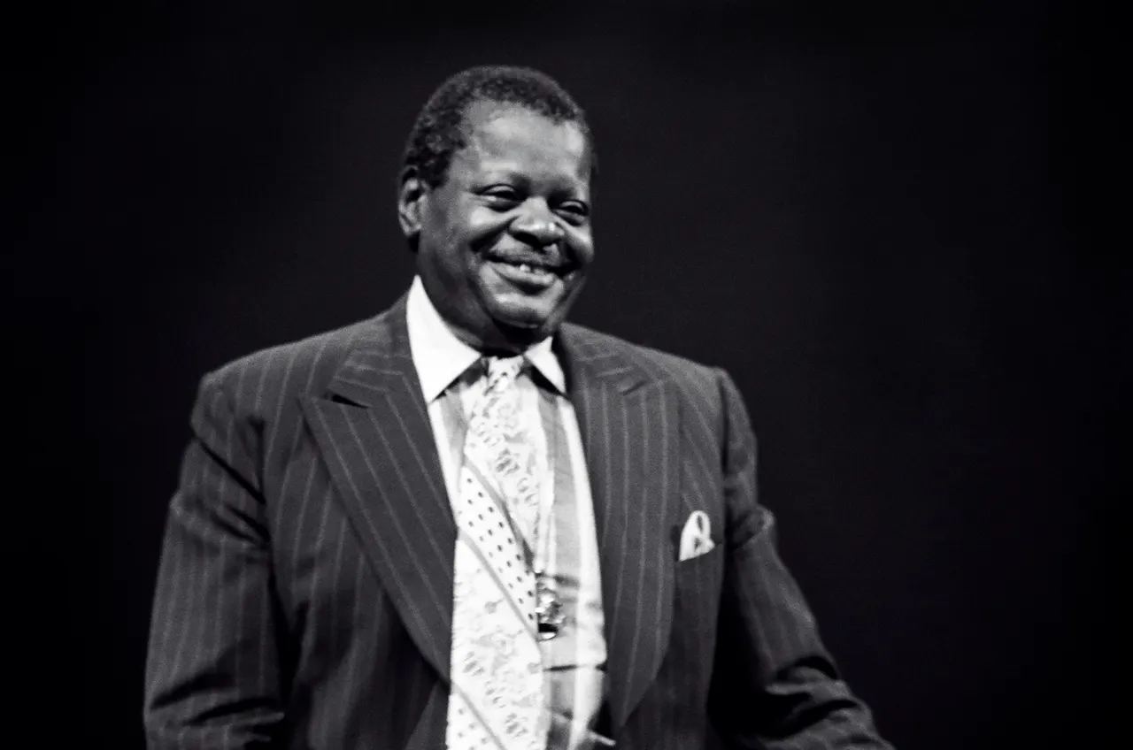Photograph of Oscar Peterson at the piano.