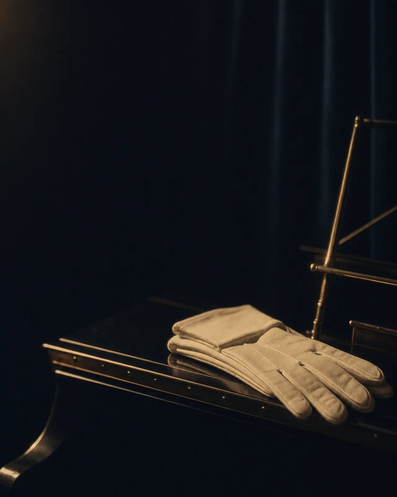 Swing era still life for Teddy Wilson: a pair of white gloves folded on a closed fallboard.